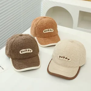 Children's lamb wool baseball caps in brown and beige with PUPPY embroidery and piping