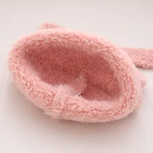 Plush pink winter knit hat for kids featuring warm fleece lining and ear protection