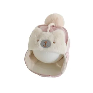 Pink plush baby trapper hat with bear face embroidery and pom-pom for winter warmth