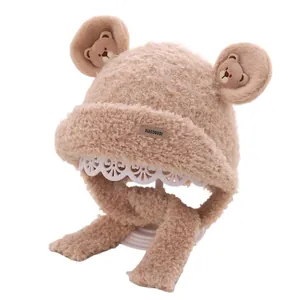 Winter plush bear hat for kids with ear flaps and fluffy beige faux fur material