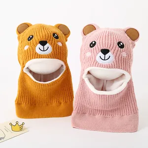 Detail of cute bear knitted balaclava for kids with warm fleece lining and 3D ears