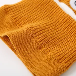 Kids orange bear winter knit hat and neck warmer with cute cartoon eye patch detail