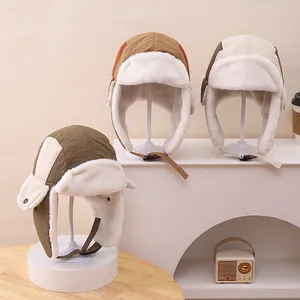 Detailed view of winter trapper hats with thick fleece lining and adjustable chin straps