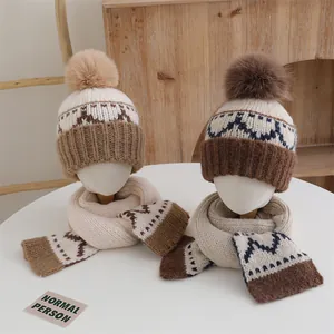 Winter knit pompom hat and scarf set for children with geometric jacquard pattern