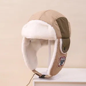 Detail of winter trapper hat showing soft faux fur lining and adjustable chin strap