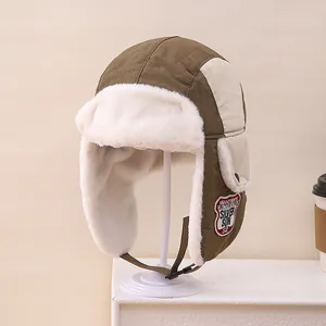 Detailed view of winter kids trapper hat with warm faux fur lining and ear flaps
