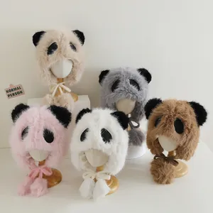 Detail showing plush panda winter hats with ear flaps and pom-pom ties in five soft colors