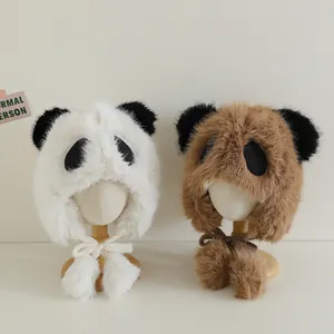 Detailed view of panda-style faux fur winter trapper hats for kids with plush earflaps