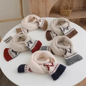 Detail of five winter knitted scarves with Nordic geometric patterns and colorful trim