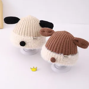 Detailed view of rib-knit baby hats with plush fur trim and cute puppy-like dog ears