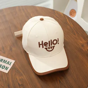 Kids' beige and brown cotton baseball cap with embroidered Hello smile face and flat brim