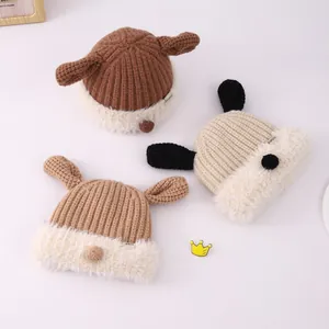 Detail of plush knitted baby beanies with cute animal ears and thick faux fur lining