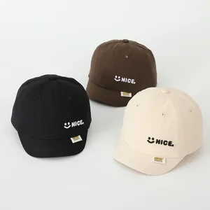 Three cotton short-brim baby baseball caps with NICE embroidery in black, brown and cream