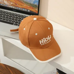 Brown cotton kids baseball cap with HioW embroidery and white contrast brim detailing