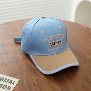Detailed view of high-quality Brooklyn embroidery on a two-tone cotton kids baseball cap