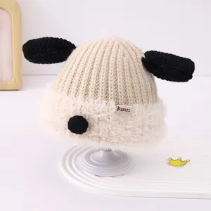 Detail of baby winter knit hat featuring plush fleece lining and cute long puppy ears