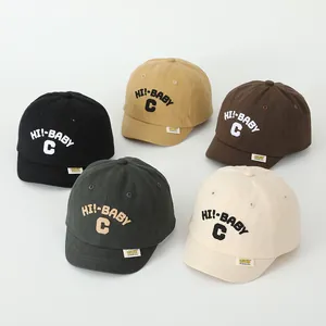 Close-up of five colorful cotton baseball caps for toddlers with HI-BABY embroidery