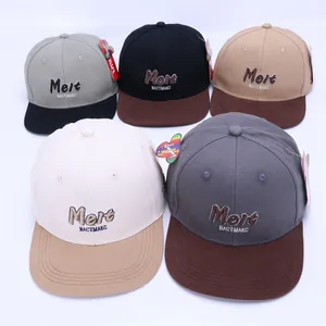 Detail of color-block kids hip hop hats featuring Melt 3D embroidery and brand tags
