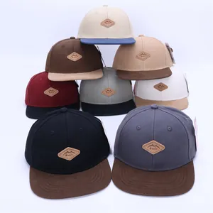Detailed close-up of colorful snapback hats collection with leather patches and flat brims