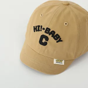 Detail of khaki cotton baby baseball cap with bold HI!-BABY C embroidery and neat stitching