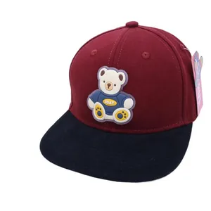 Kids color-block baseball cap in burgundy and navy featuring a 3D cartoon bear patch