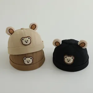 Detail of baby landlord hats in beige, coffee, and black with cute plush bear ears