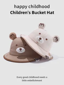 Detail of baby bear bucket hats showing 3D ears and cute embroidered bear faces