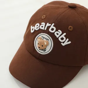Detail of baby baseball cap featuring 3D teddy bear patch and bearbaby embroidery