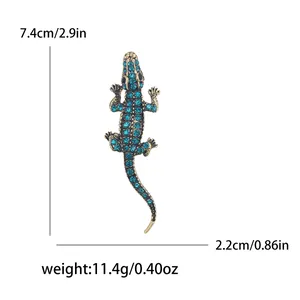 Vintage gold alloy crocodile brooch with green rhinestones and size measurements