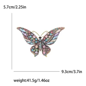 Vintage vlinderbroche met kleurrijke strassteentjes en afmetingen in inches