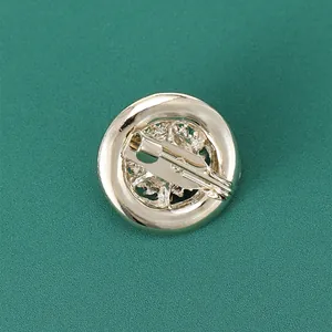 Back view of vintage round brooch with micro-set zircon and secure pin closure