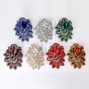 Detail showing seven colors of vintage crystal rhinestone brooches on display cards