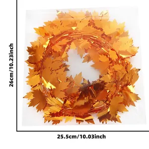 Detail view of 7.5m Thanksgiving maple leaf garland in clear plastic packaging