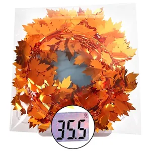 7.5m Autumn maple leaf garland decoration in packaging showing 35.5g weight detail
