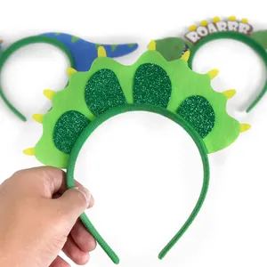 Green sequined dinosaur headband for kids featuring cartoon felt dragon horn design