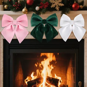 Three large velvet Christmas bows in pink, green, and white for tree decoration