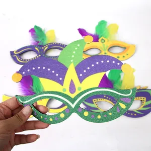 Handheld Mardi Gras carnival jester mask with colorful feathers and gold glitter accents
