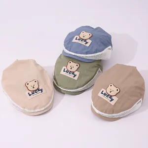Detailed view of kids breathable mesh beret caps with cute bear embroidery patches