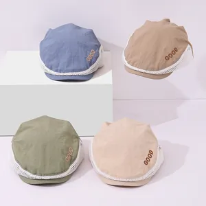 Detail view of mesh beret hats with NICE DAY embroidery and breathable patchwork fabric