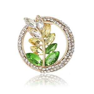 Fashion retro wheat spike brooch with gold finish, green crystals and clear rhinestones