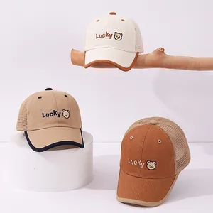 Close-up of Lucky bear embroidery and breathable mesh detail on children's baseball cap