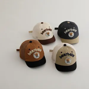 Detail view of four baby baseball caps with bear embroidery and breathable summer mesh back