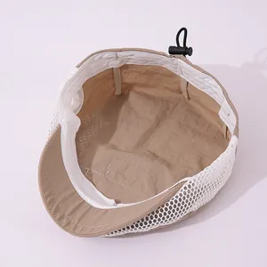 Internal detail of khaki mesh baby sun hat showing breathable fabric and adjustable drawcord