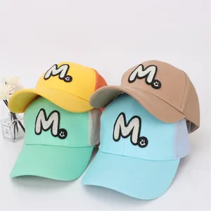 Kids breathable mesh trucker hats with M embroidery in yellow, khaki, green and blue