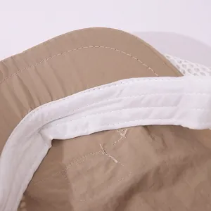 Close-up of khaki ripstop fabric and white breathable mesh on the toddler sun hat
