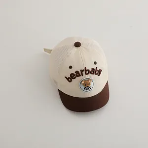 Detail of baby mesh baseball cap featuring bearbaby embroidery and teddy patch