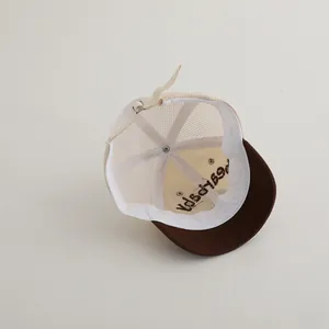 Detail of baby mesh cap with adjustable leather back strap and internal embroidery