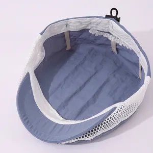 Detail view of breathable mesh lining and adjustable drawcord on blue child sun hat