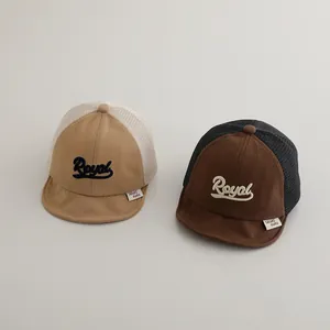 Detail showing two mesh baby baseball caps with Royal embroidery and breathable mesh panels