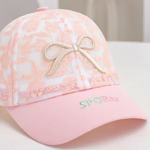 Pink lace mesh baseball cap for girls featuring floral patterns and a bow embroidery